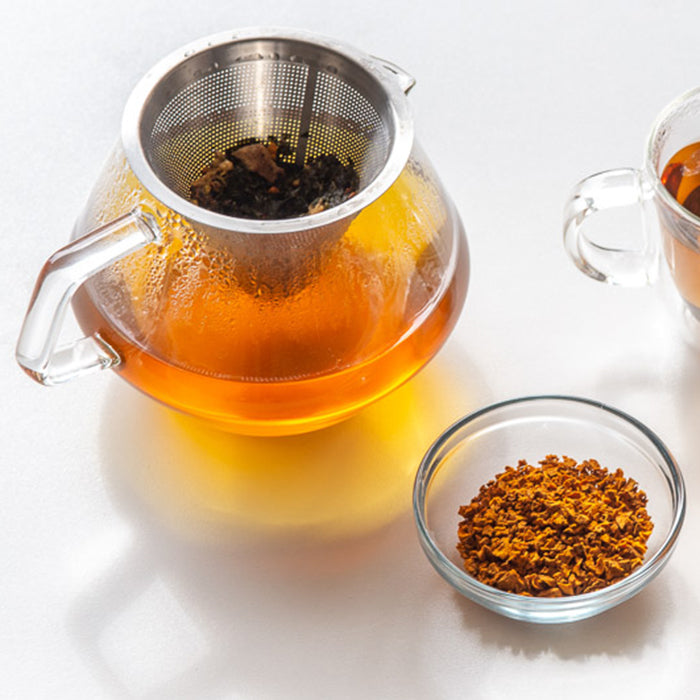 Turmeric tea in a tea pot