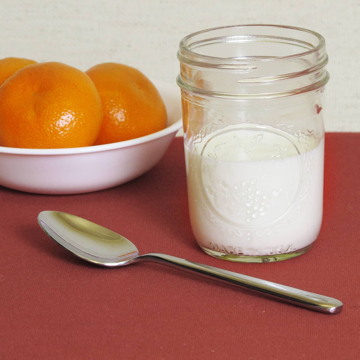 A jar of milk and clementines