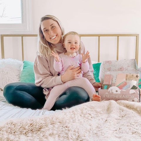 Mother and baby with a TheraBox