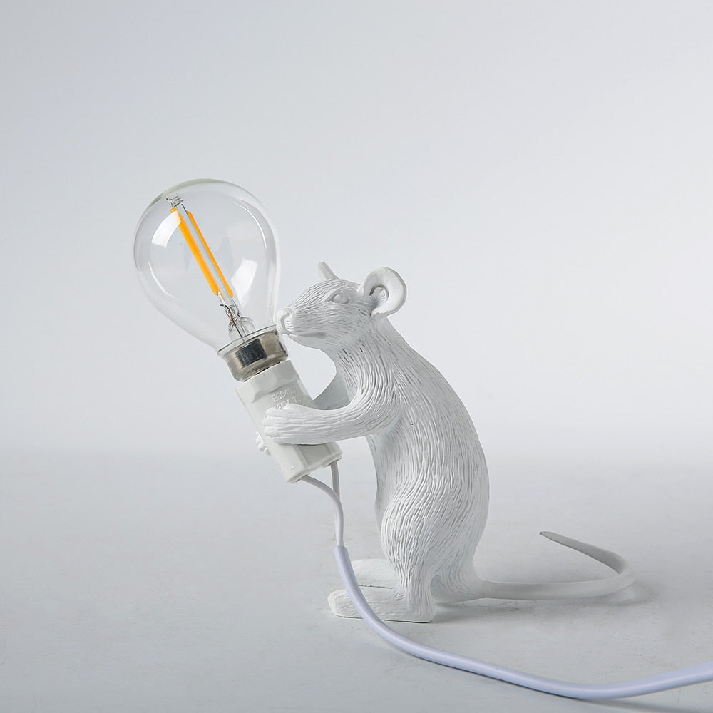 animal holding light bulb lamp