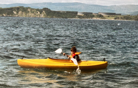 Charles Daly kayaking as a child