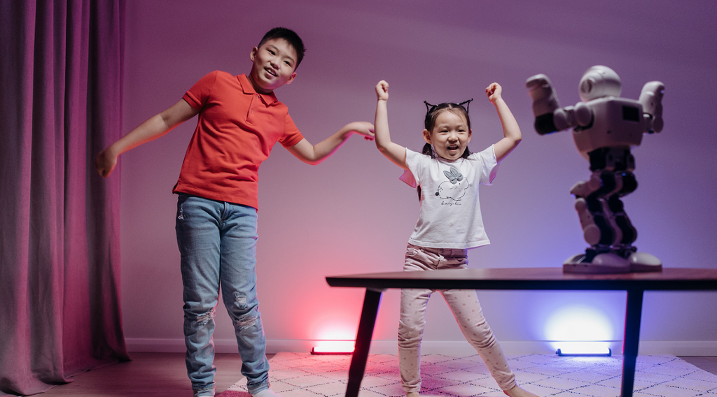 sibling playing with an interactive toy