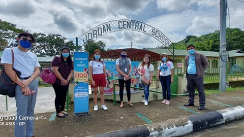 The SM Store employees from Ilo-ilo city traveled to the island of Guimaras to distribute books and school supplies collected from the Donate A Book program.