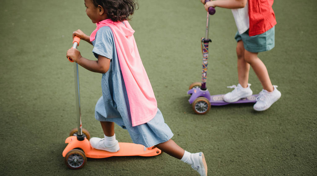 Children riding scooters