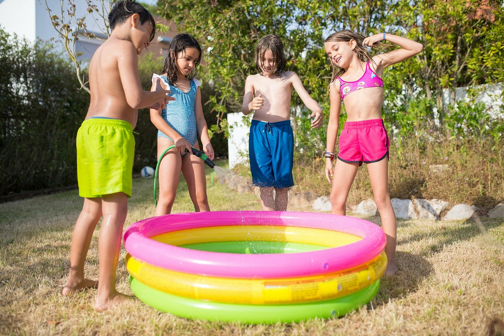 Kids playing with their inflatable pool
