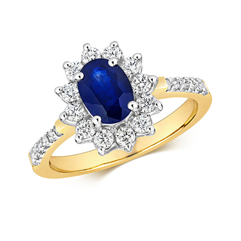 9CT Yellow Gold ring with a white gold wetting. Set with Oval Sapphire in a Cluster of round Diamonds which are set in a claw setting plus Diamonds set in the shoulders.