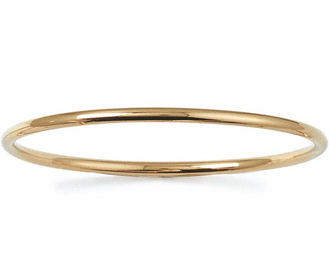 This solid round cut slave bangle is a must for any jewellery collection because it's so easy to accessorise with whatever you are wearing.  The 'Slave to Love' 18k gold plated bangle is great for a self purchase or gift and can be layered up with other bangles for a stacking affect