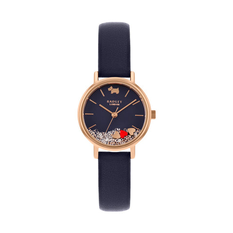 Radley Round Rose Gold Plated case which has a navy face with floating stones and hearts plus navy leather strap.