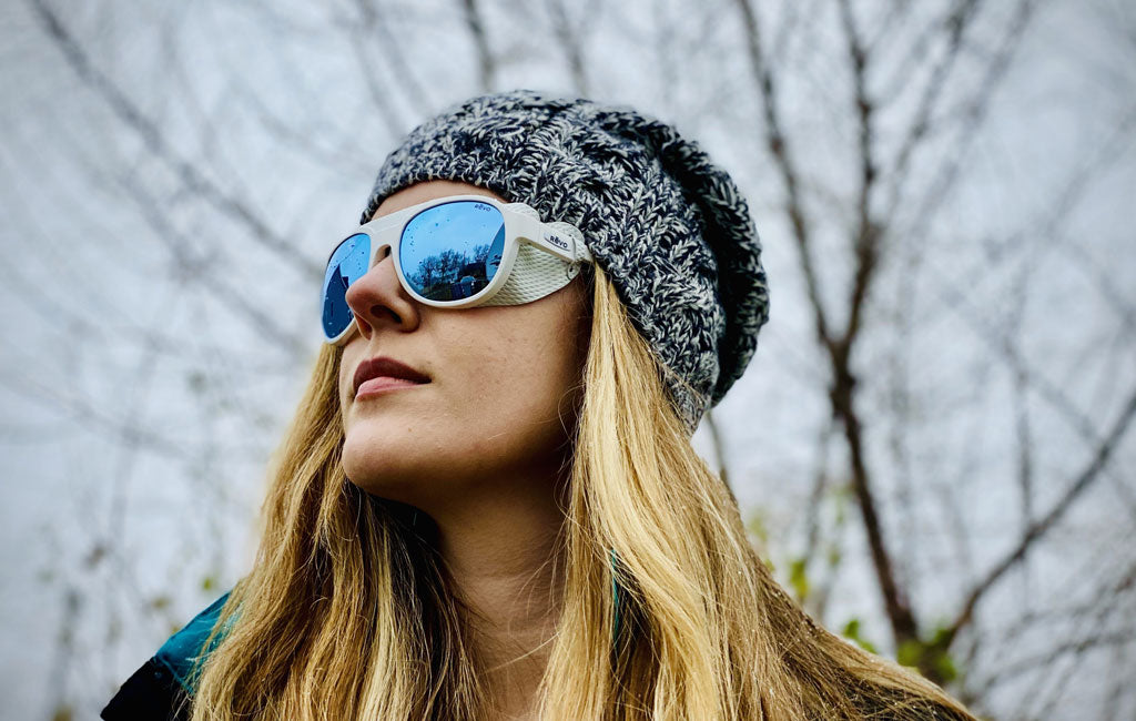 glacier glasses revo worn by woman in snow