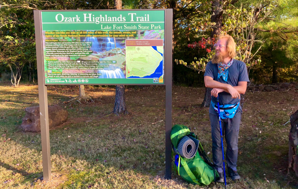 hiker-next-to-sign-ozark-highlands-trail