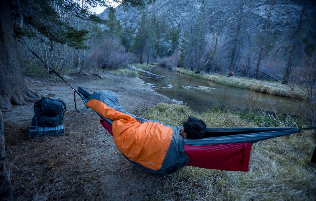 hiker using a hammock underquilt