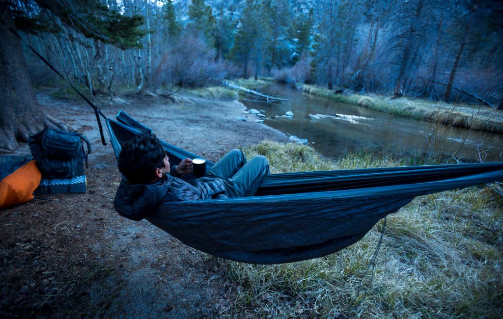 hiker using a hammock underquilt