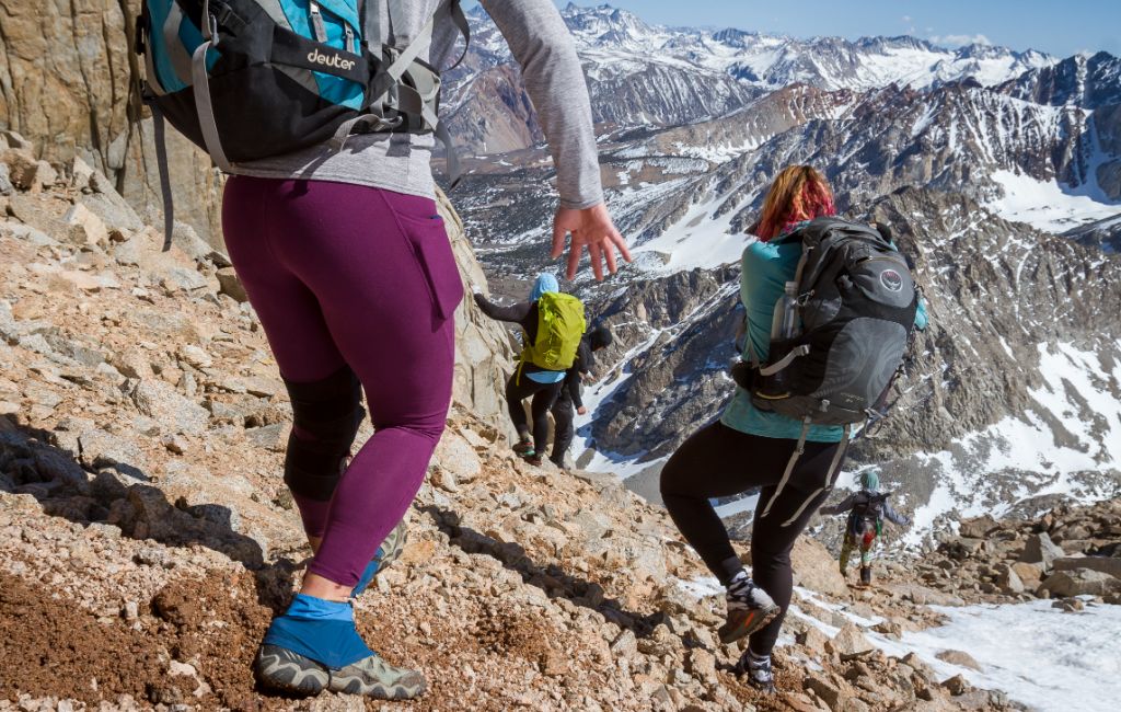 3 hikers wearing gaiters