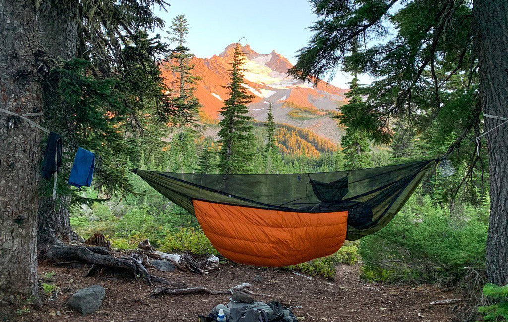 full hammock camping setup with underquilt and bug net