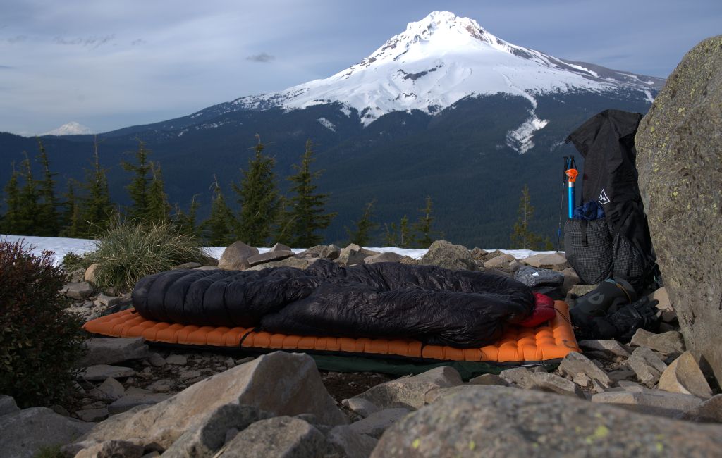 sleeping bags overlooking mountains