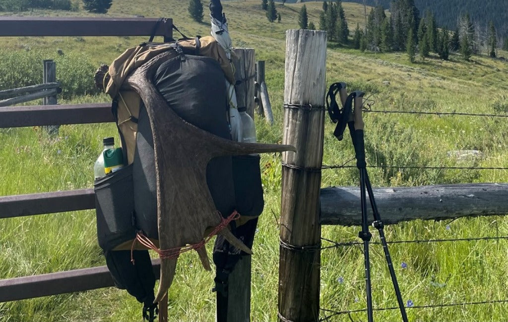 swift x backpack and my poles in a field