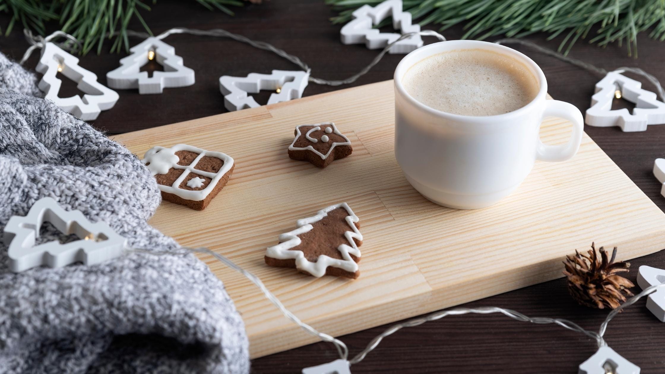 Cup of coffee with holiday cookies