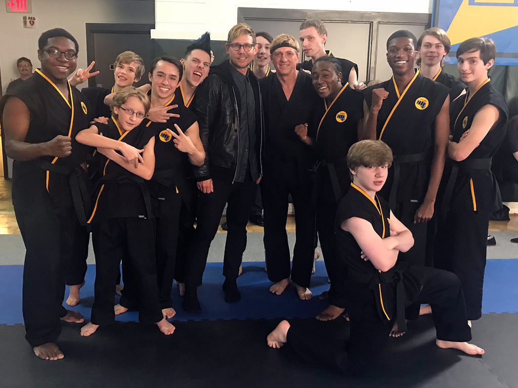 Frank Helmer with some of the cast of Cobra Kai