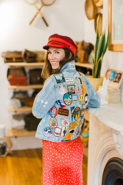 photo of emily bargeron wearing a "life jacket" where she collects patches and adds them onto a denim jacket like a scrapbook