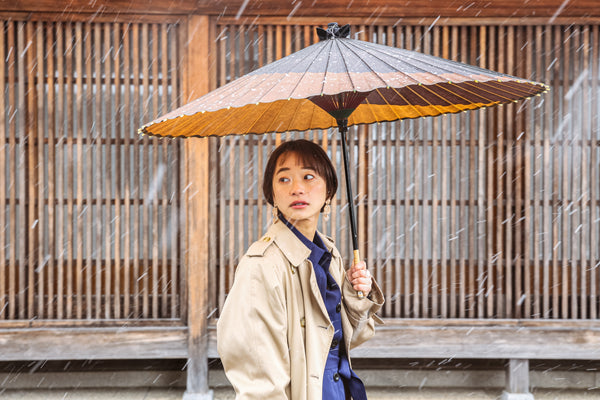 Woman holding a Gifu Japanese umbrella