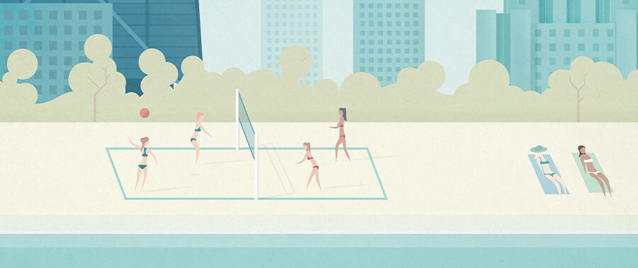 Women playing volleyball on a beach in Chicago