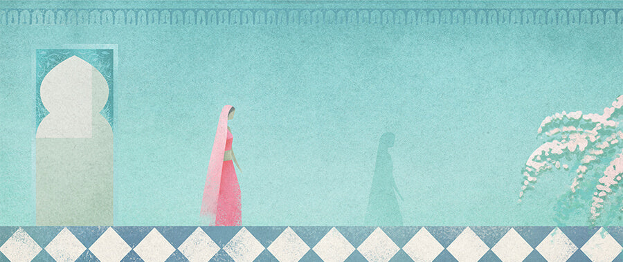 A women walks through a courtyard in India