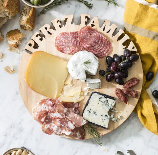 overhead: customized charcuterie board with the words Perez Family