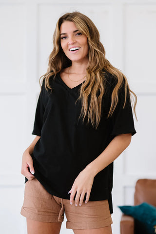 short sleeve loose black top with side slits Styled by Steph Online Boutique Granger, IN