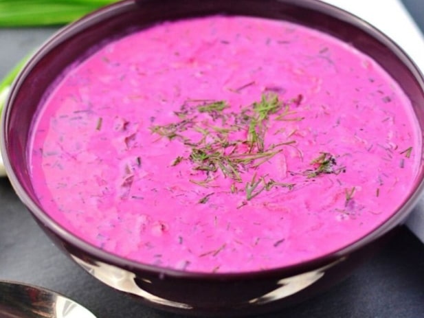 Cold red borscht soup with fresh parsely