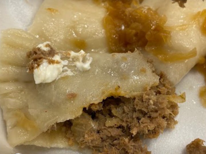 Meat pierogi topped with carmelized onions