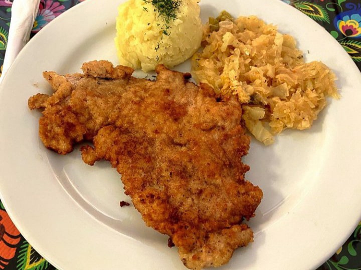 Las Vegas wiener schnitzel served with mashe potatoes and sauerkraut