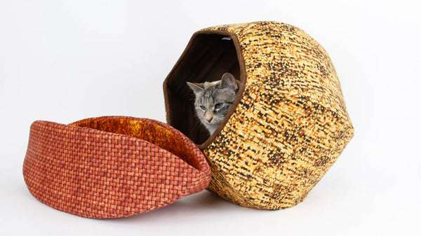 This Cat Ball® cat bed and Cat Canoe® are made in cotton fabrics that look nice together