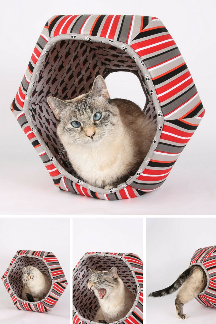 The Cat Ball cat bed made in pirate fabric with bold stripes sharks and skulls