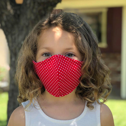 A 5 year old girl wearing our face mask design