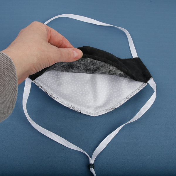This face mask design has a filter pocket you access from the bottom. The wide opening makes it easier to add a filter. 