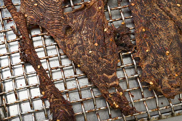 Drying jerky on rack at factory