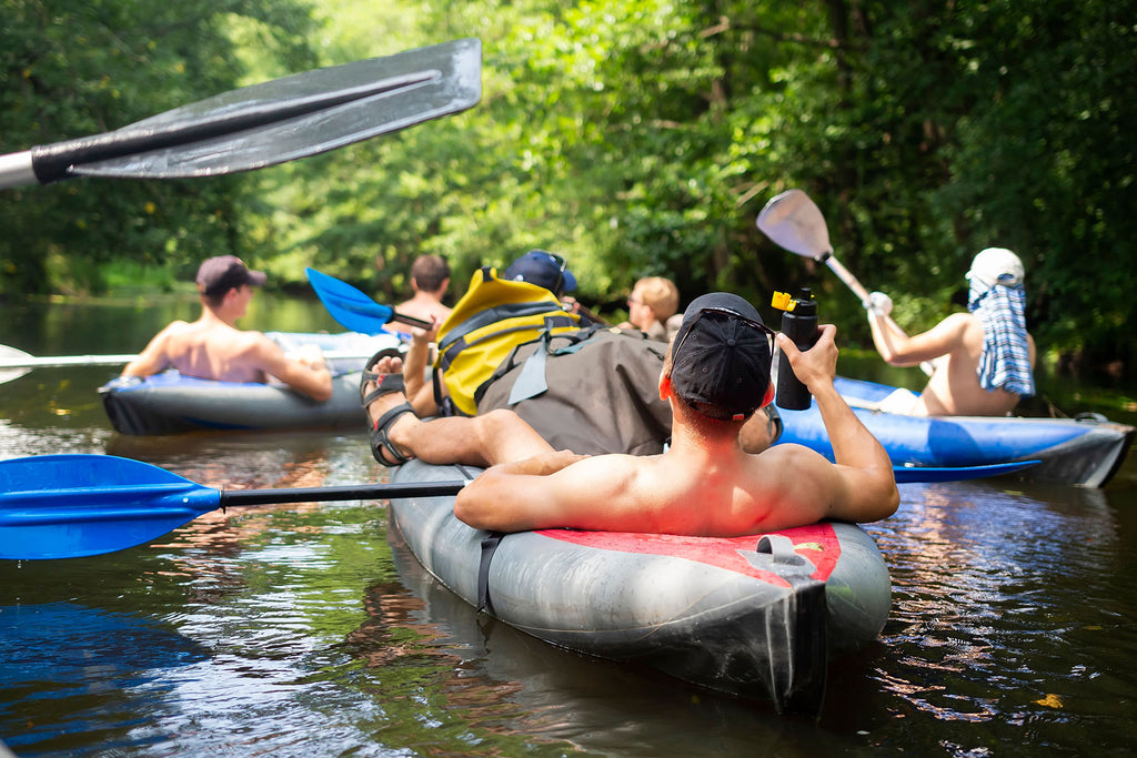 People floating down river on tubes.