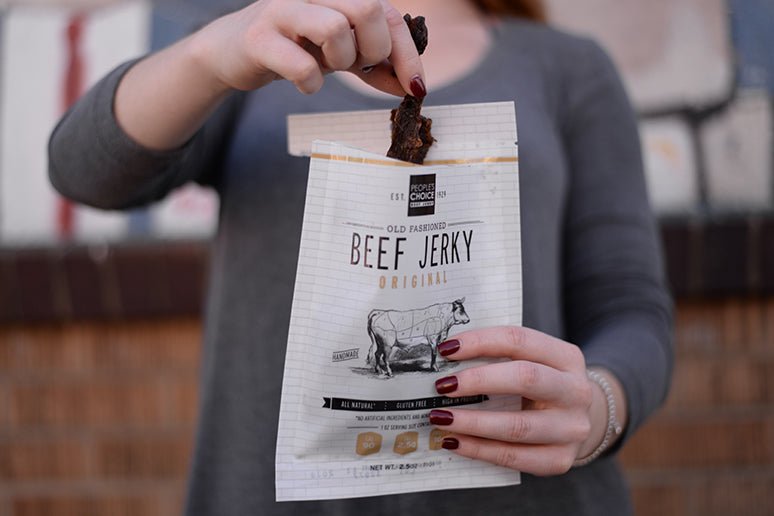 Someone holding a bag of Old Fashioned Original Beef Jerky