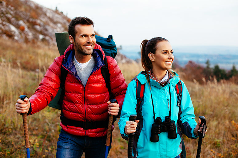 A couple hiking near the ocean.