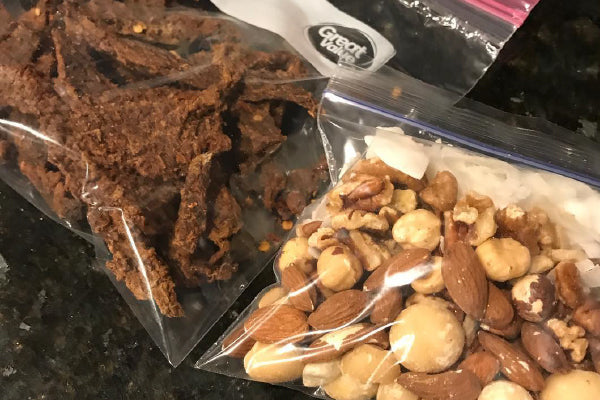 Snacks of jerky and nuts in ziplock bags