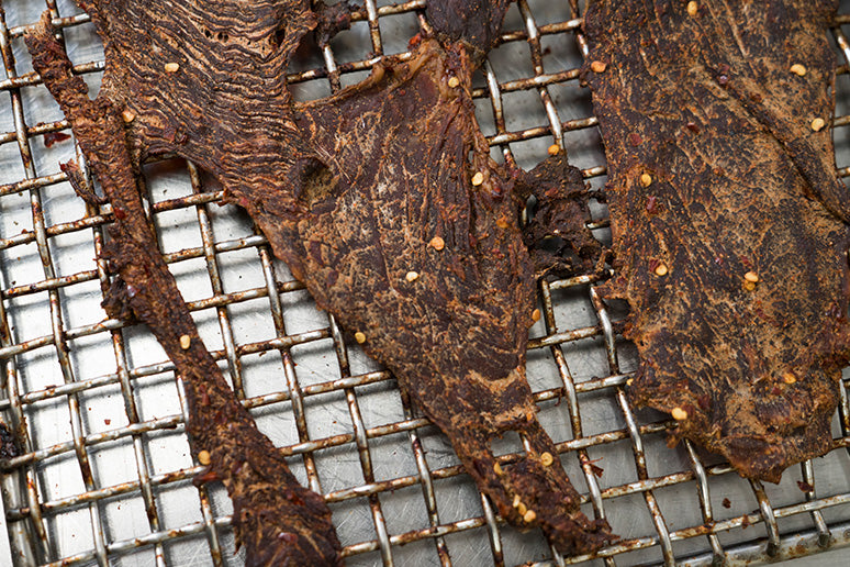 During the cooking and drying process, moisture is removed from the meat. 