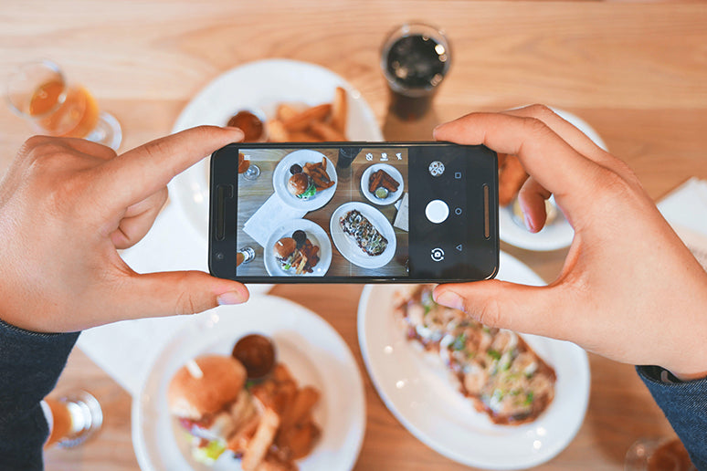 Foodie Blogger taking a photo.