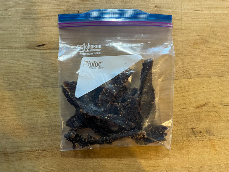 Freezer plastic bag for storing beef jerky.