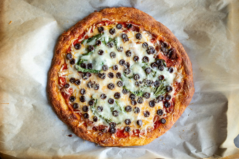 Top your pizza, bake until golden brown delicious, and enjoy!