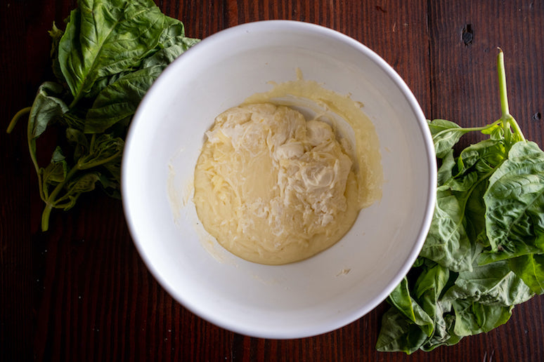 Melt the mozzarella and cream cheese in a microwavable bowl and stir to combine