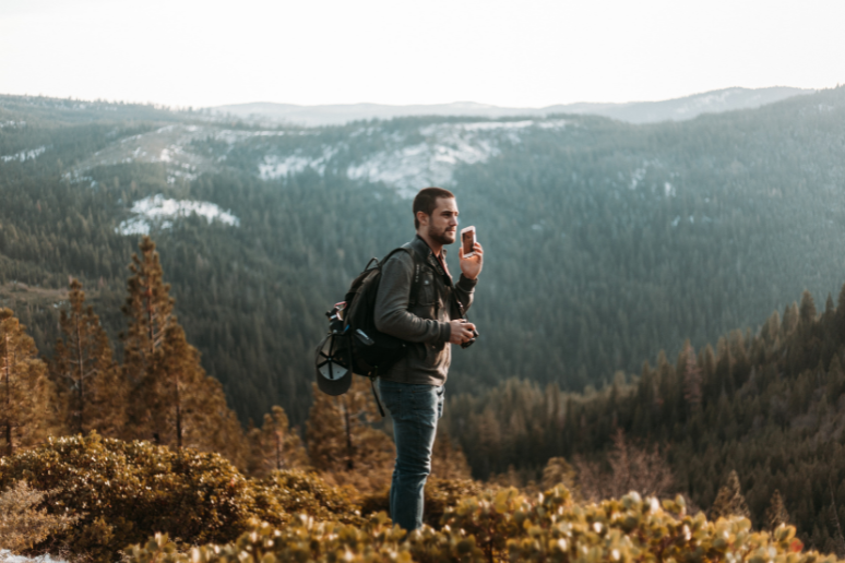 Man on the phone on a hike