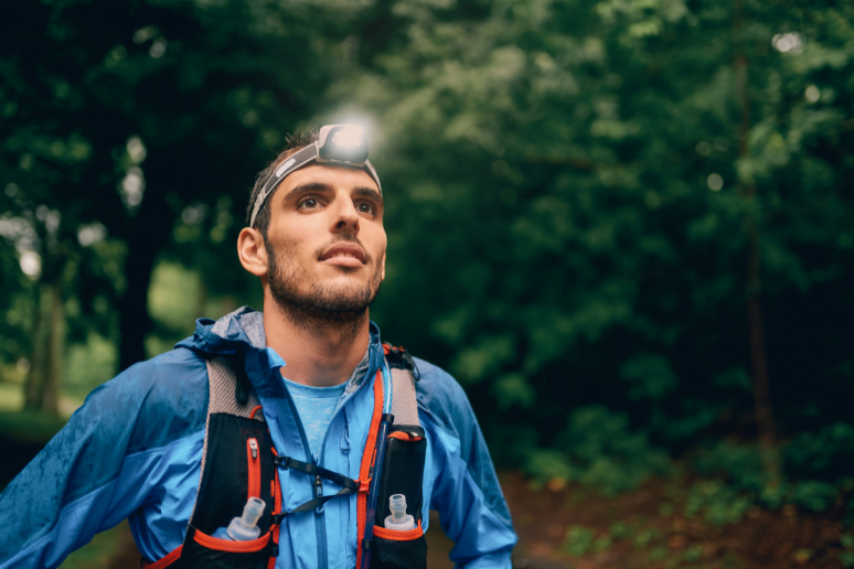 Man Wearing LED Headlamp