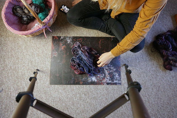 Yarn dyer taking product photos of their hand dyed yarn