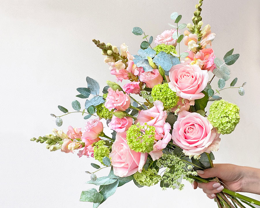 Summer bouquet with pink snapdragons, pink roses and green viburnum - LOV Flowers