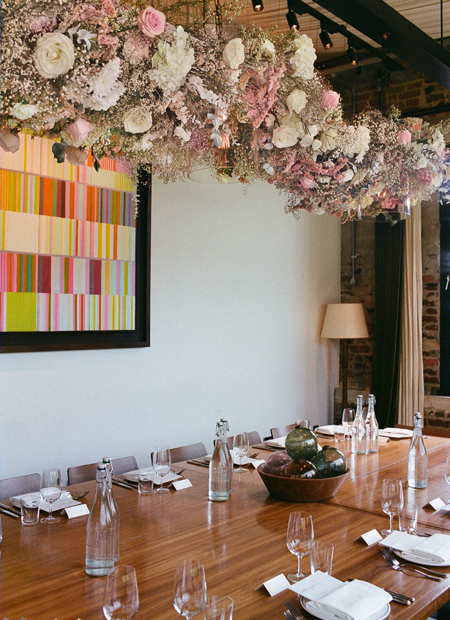 White and pink hanging floral wedding installation with gypsophila roses and peonies